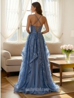 Light Blue Spaghetti Strap Lace Appliqué Layered Asymmetrical Mesh Gown捕捉静谧的色彩美学，这款礼服以浅蓝色调呈现如晨曦般的清透感。上半身覆以精美蕾丝贴花，配合极简细吊带平直领口，勾勒出优雅的肩颈轮廓。裙摆采用独特的层叠不对称网纱设计，在行进间呈现如波浪般的轻盈动态。二十年匠心工艺确保了网纱的支撑力与亲肤感，是高端舞会、婚礼伴娘或正式庆典的理想之选。