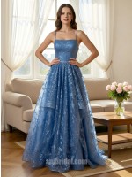 Light Blue Spaghetti Strap Lace Appliqué Layered Asymmetrical Mesh Gown捕捉静谧的色彩美学，这款礼服以浅蓝色调呈现如晨曦般的清透感。上半身覆以精美蕾丝贴花，配合极简细吊带平直领口，勾勒出优雅的肩颈轮廓。裙摆采用独特的层叠不对称网纱设计，在行进间呈现如波浪般的轻盈动态。二十年匠心工艺确保了网纱的支撑力与亲肤感，是高端舞会、婚礼伴娘或正式庆典的理想之选。